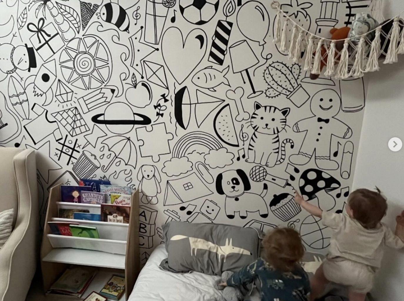 A custom black-and-white doodle mural Ashleigh drew across a child's bedroom wall